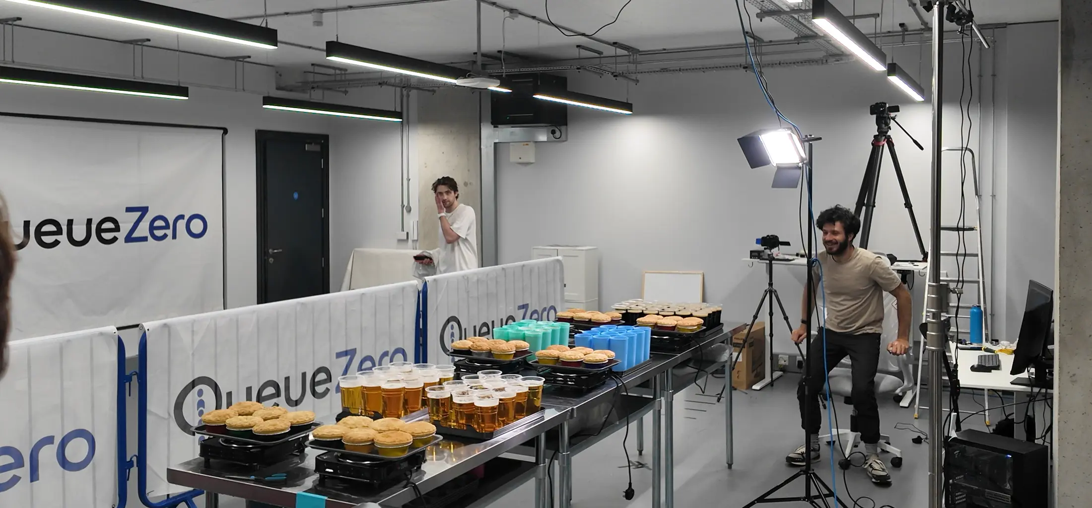 Full-size QueueZero service lane with prepared products, service-side access and overhead cameras